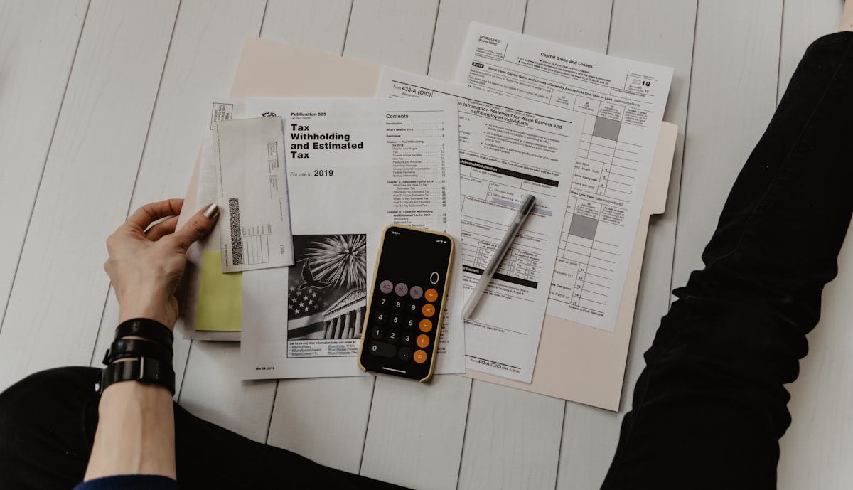Ballarat refinancing mortgage broker reviewing loan documents and repayment calculator on a desk